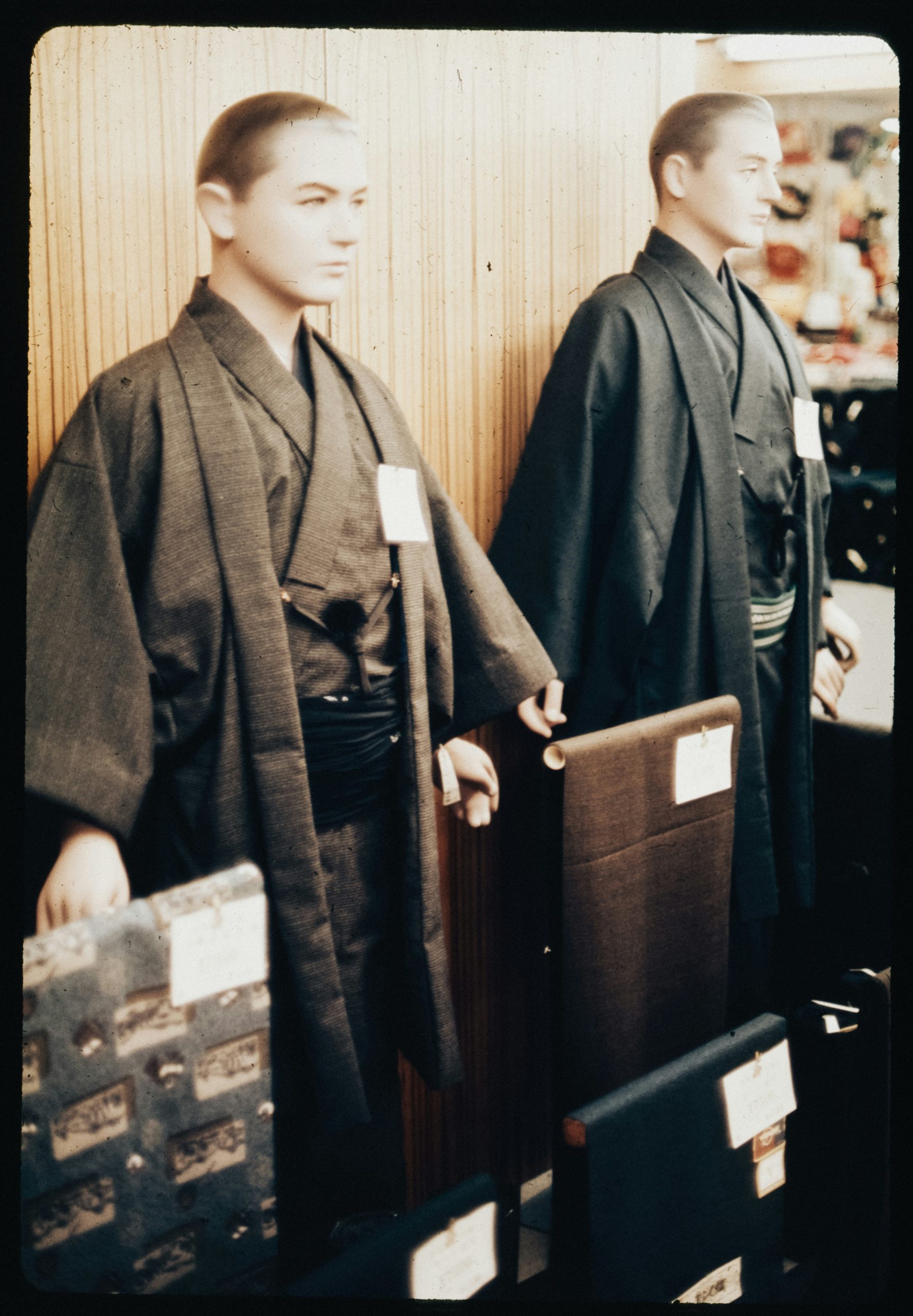 Professional kimono rental service showing men in formal montsuki hakama traditional Japanese attire, demonstrating authentic cultural dress options for Coming of Age ceremonies
