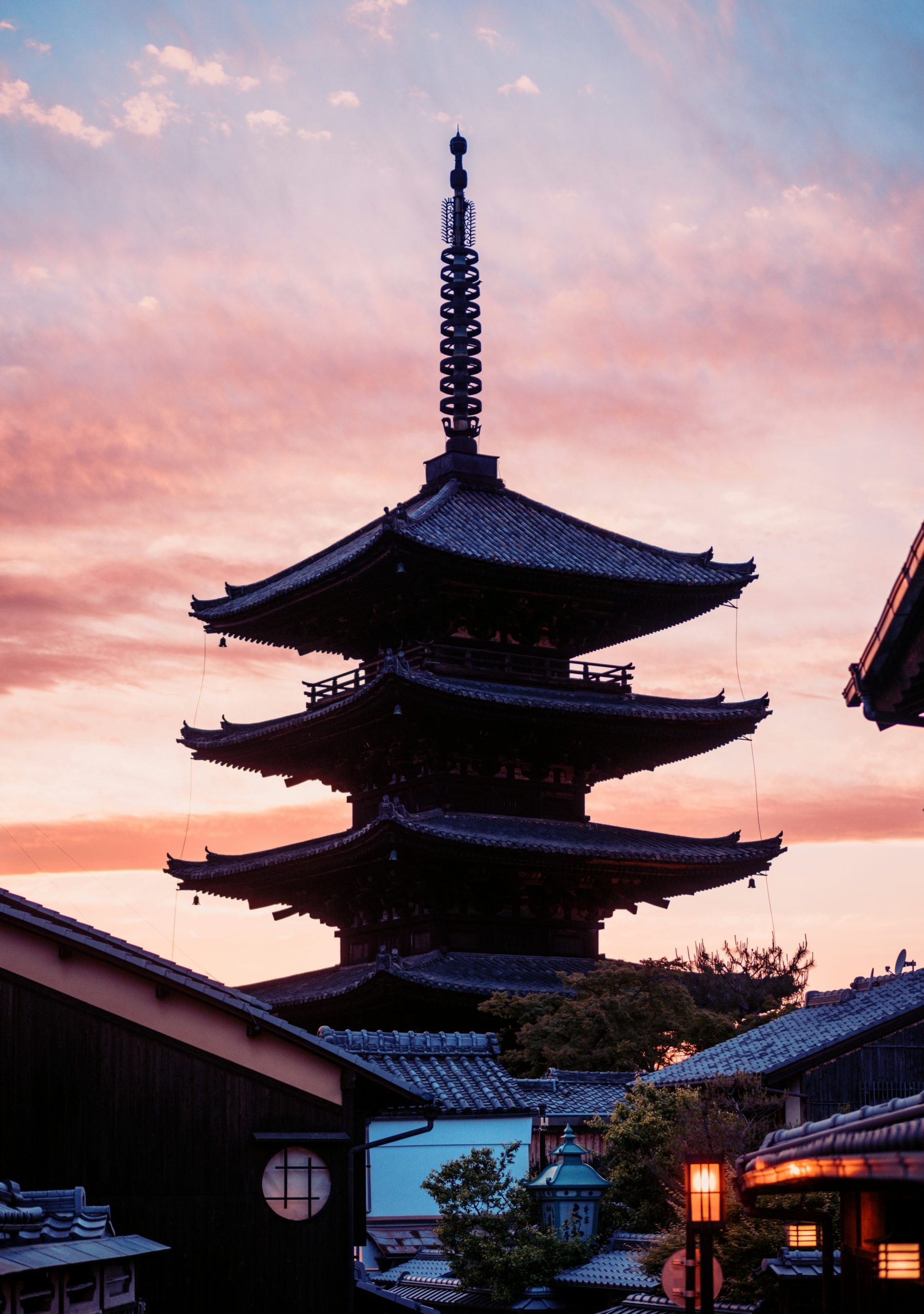 Modern kimono rental shop storefront in Kyoto with traditional wooden facade and elegant displays, representing the contemporary preservation of Japanese cultural traditions in the ancient capital