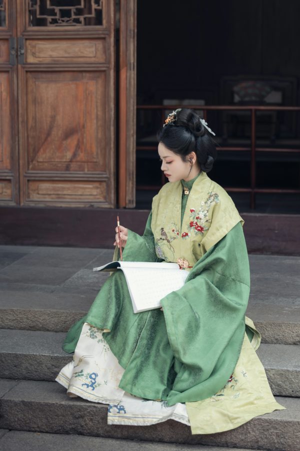 Exquisite traditional Japanese kimono textile pattern featuring elegant crane motifs in ornamental style, showcasing the intricate symbolic designs that carry deep cultural meaning in Japanese poetry and art