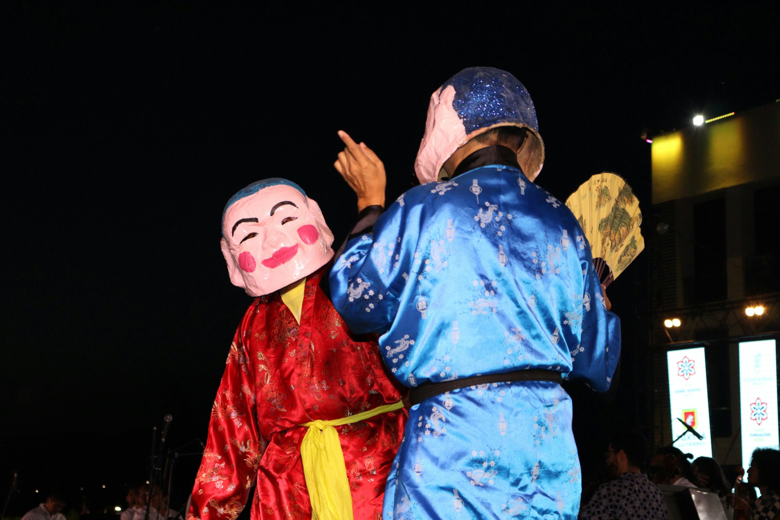 Traditional Japanese Bunraku puppet theater performance with elaborate puppets and traditional stage setting