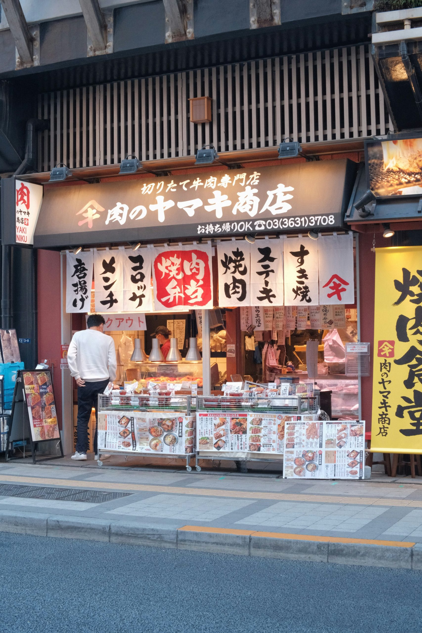 Traditional Japanese festival street food including takoyaki, yakisoba, and other delicious summer treats at night market stalls