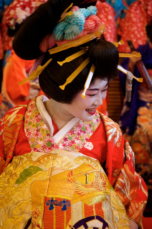 Woman wearing traditional kimono in Kyoto with elegant pose showcasing Japanese cultural dress and styling