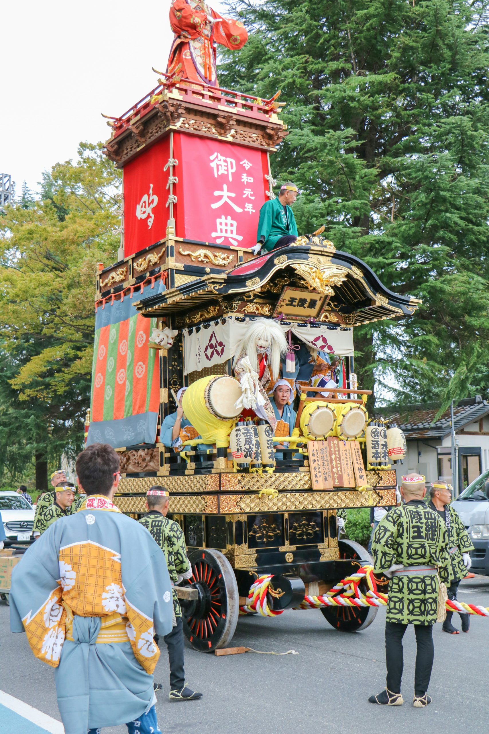 Spectacular Gion Matsuri festival procession in Kyoto featuring elaborate traditional floats and participants wearing authentic historical kimono and ceremonial dress, representing over 1000 years of Japanese cultural heritage and religious celebration