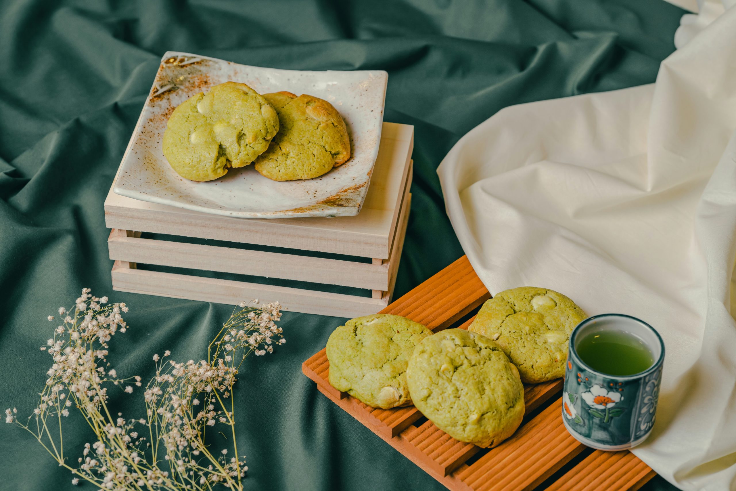 Elegant traditional Japanese matcha sweets and wagashi confections served with green tea, ideal accompaniments for a refined kimono picnic experience