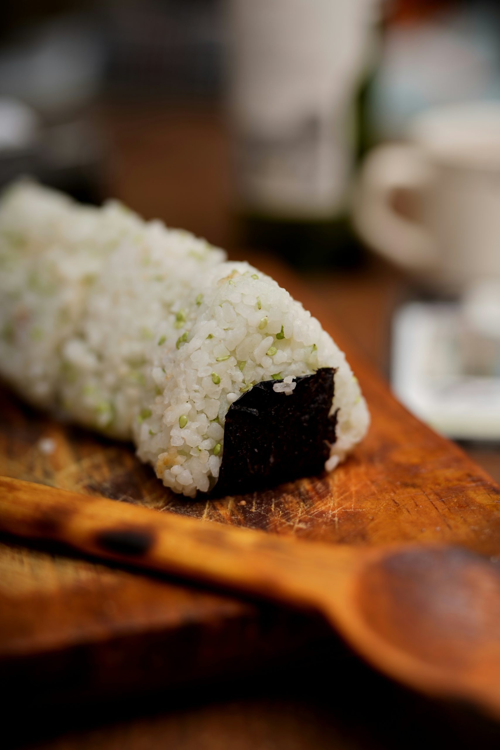 Traditional Japanese onigiri rice balls with nori seaweed wrapping, perfect for kimono picnic bento box lunch by Kamo River
