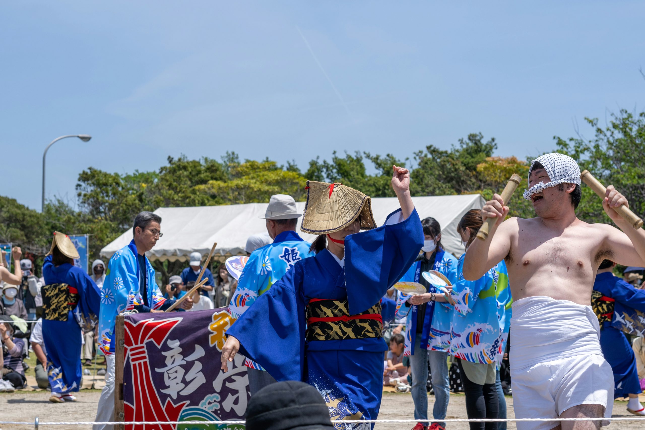 Traditional oni demon performer in red mask and costume during Setsubun festival ceremony at Kyoto temple