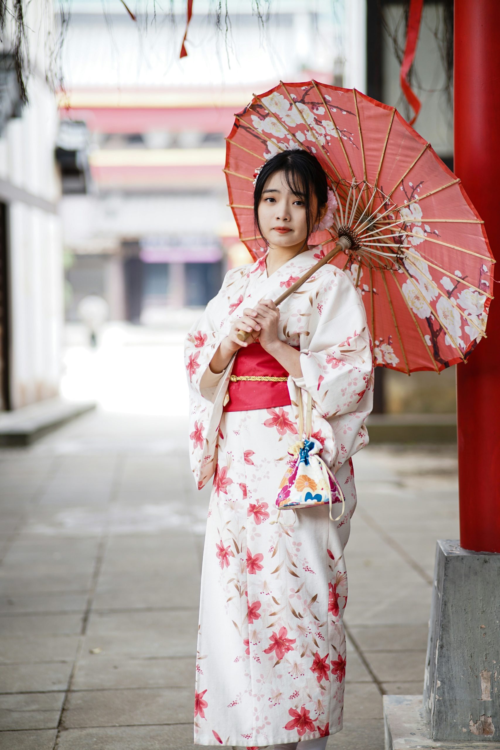 Woman wearing elegant traditional kimono in historic Gion district Kyoto Japan showcasing modern kimono rental experience and cultural immersion