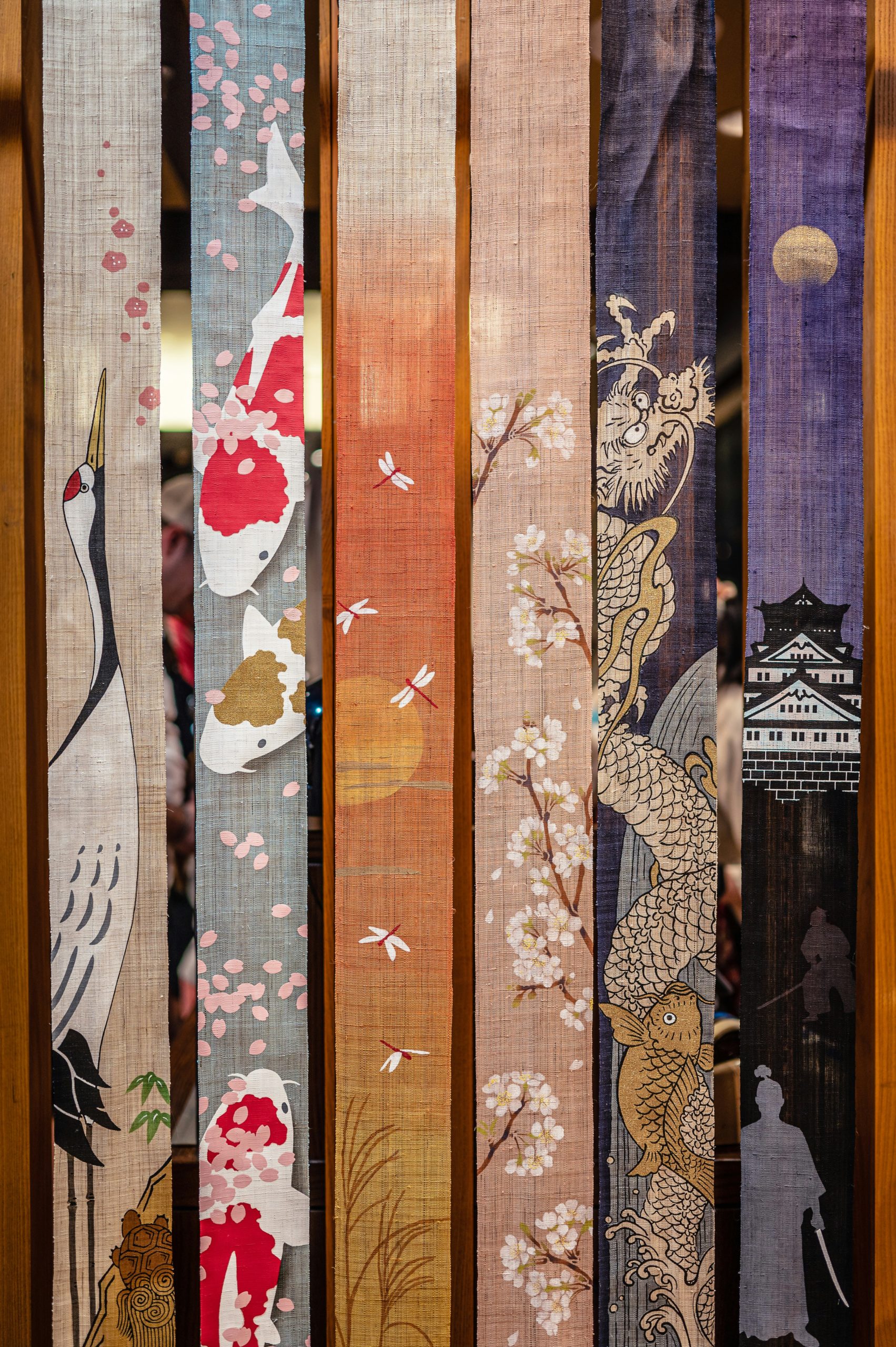 Interior of traditional kimono rental shop in Kyoto displaying colorful array of authentic Japanese kimono and yukata for tourists and visitors