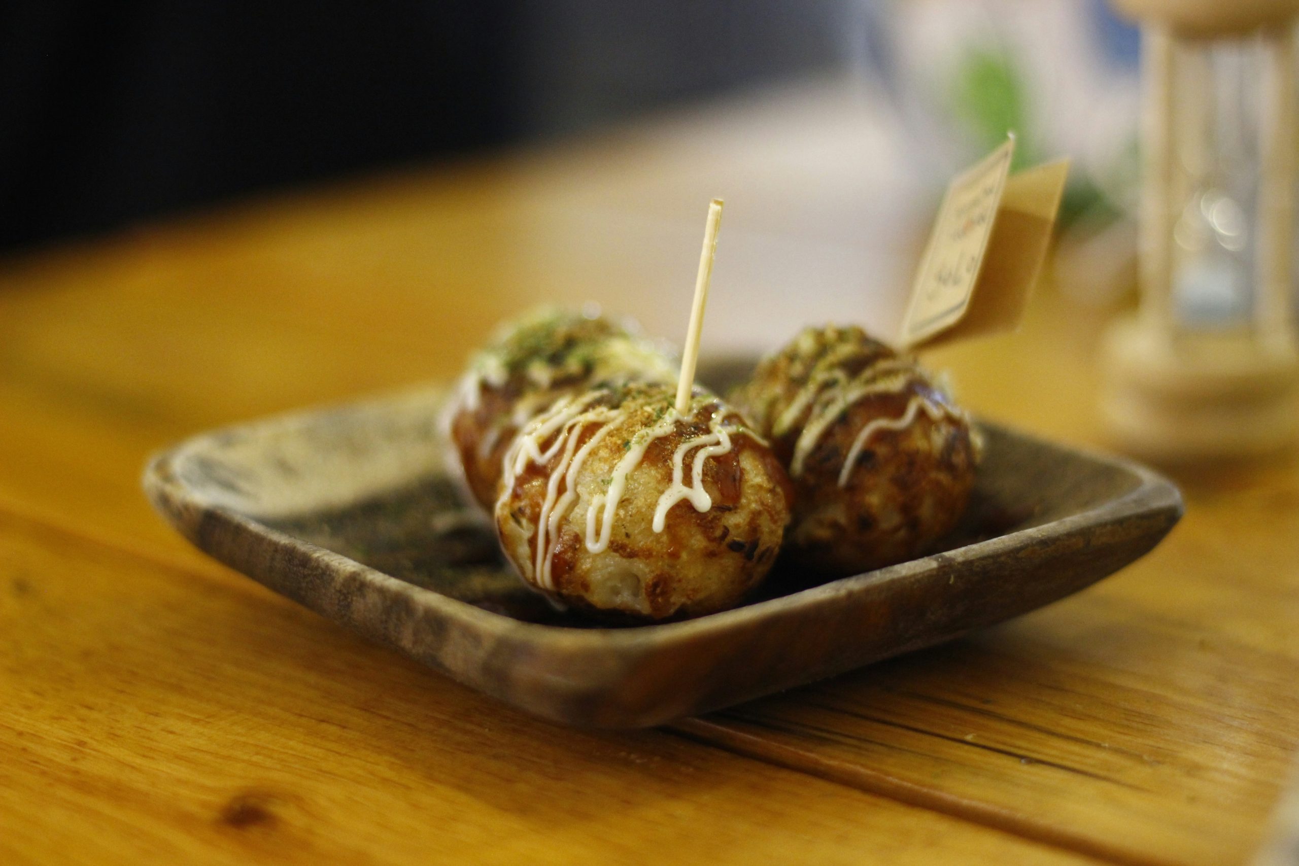 Traditional Japanese festival food including takoyaki octopus balls, kakigori shaved ice, and taiyaki fish-shaped pastries at summer matsuri