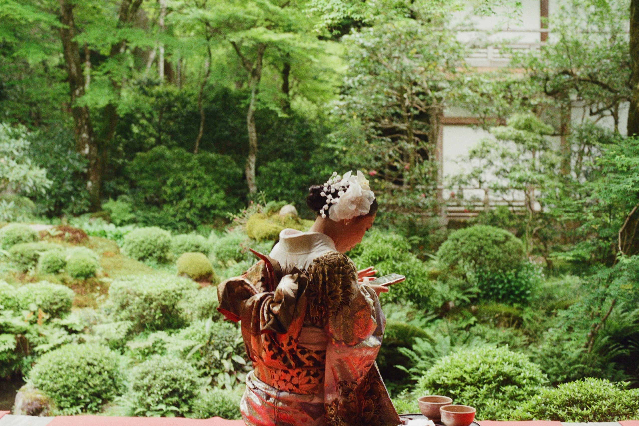 Traditional Japanese tea ceremony participants wearing formal kimono attire demonstrating cultural refinement and ceremonial dress protocols