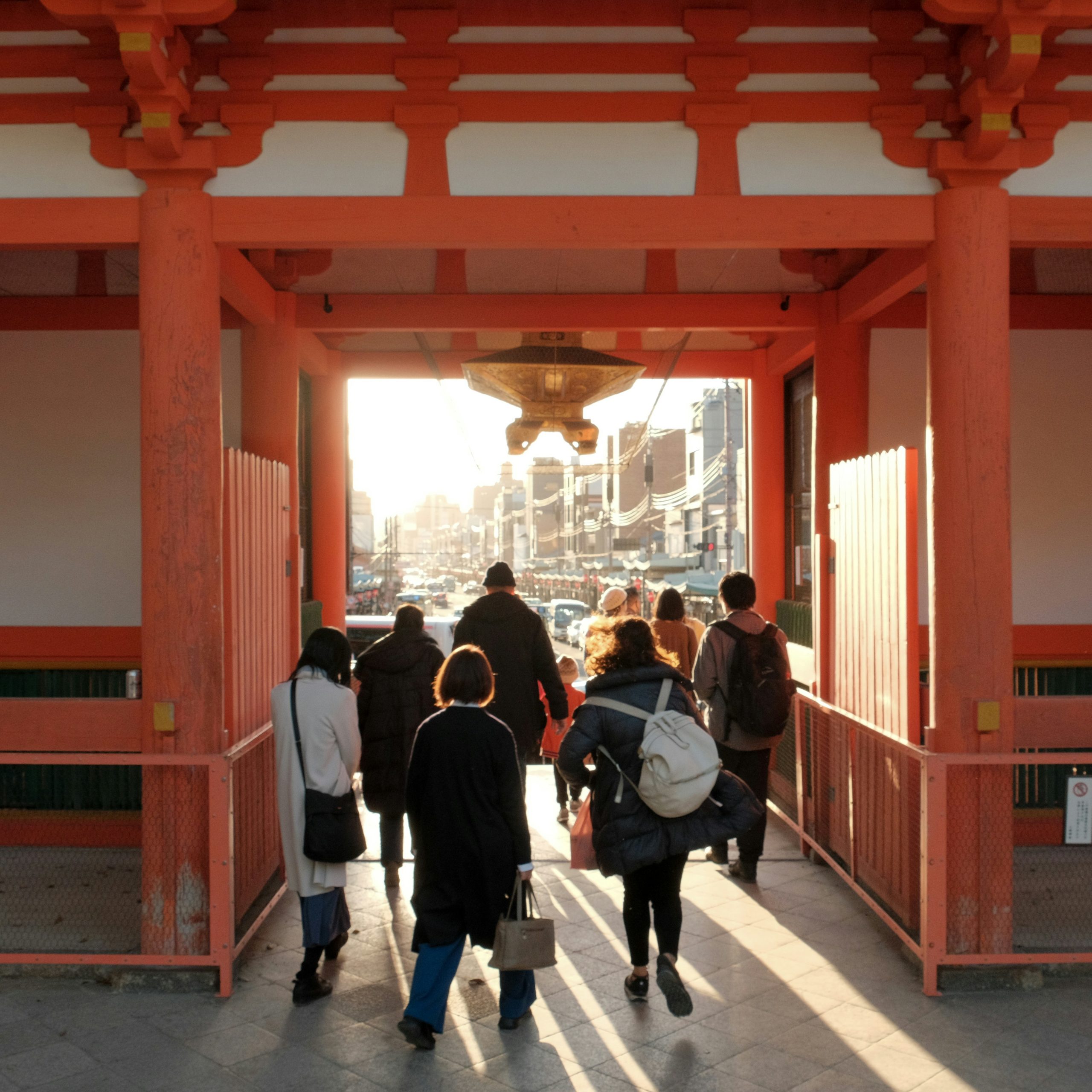 Traditional Gion district in Kyoto with historic wooden buildings, lanterns, and traditional Japanese architecture at dusk