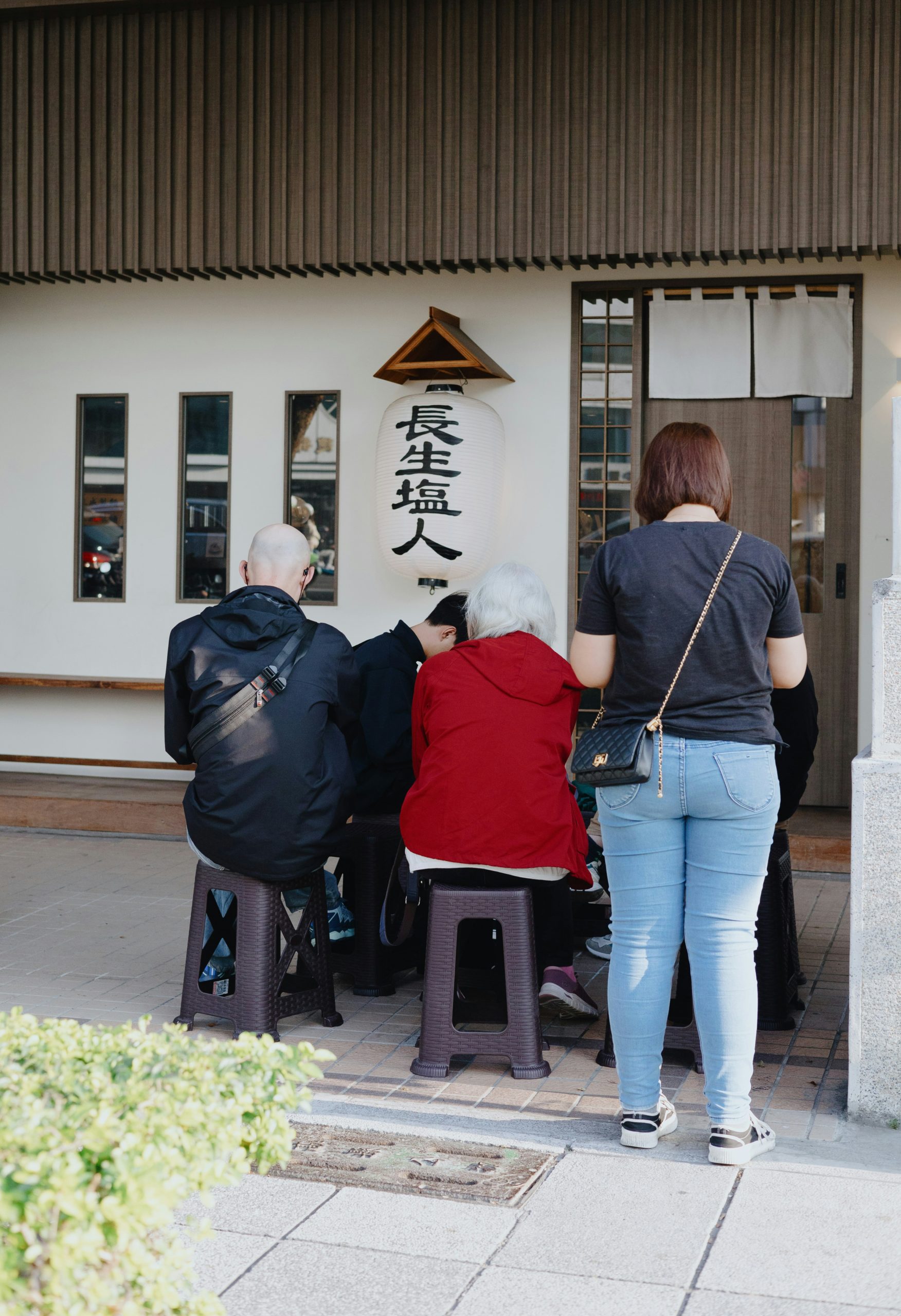 Elegant Japanese calligraphy scroll displaying the Four Seasons kanji characters (春夏秋冬) in traditional black ink brushwork, representing seasonal beauty and the cyclical nature of Japanese aesthetic philosophy
