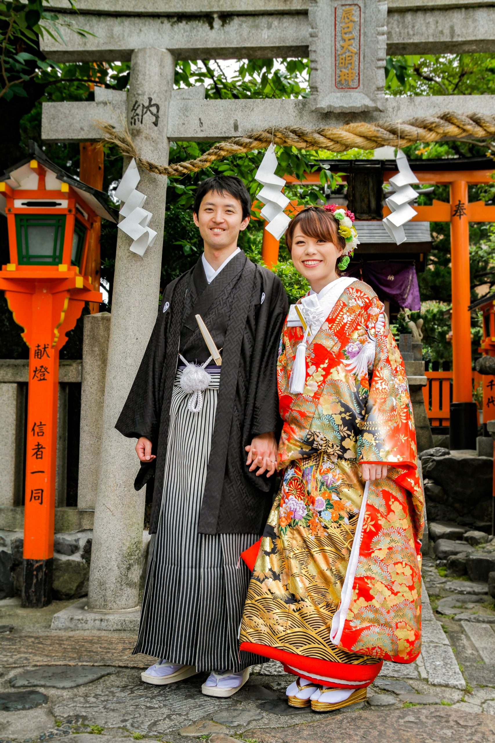 Woman in traditional kimono admiring beautiful autumn maple leaves (momiji) at Kiyomizudera Temple during fall foliage season in Kyoto