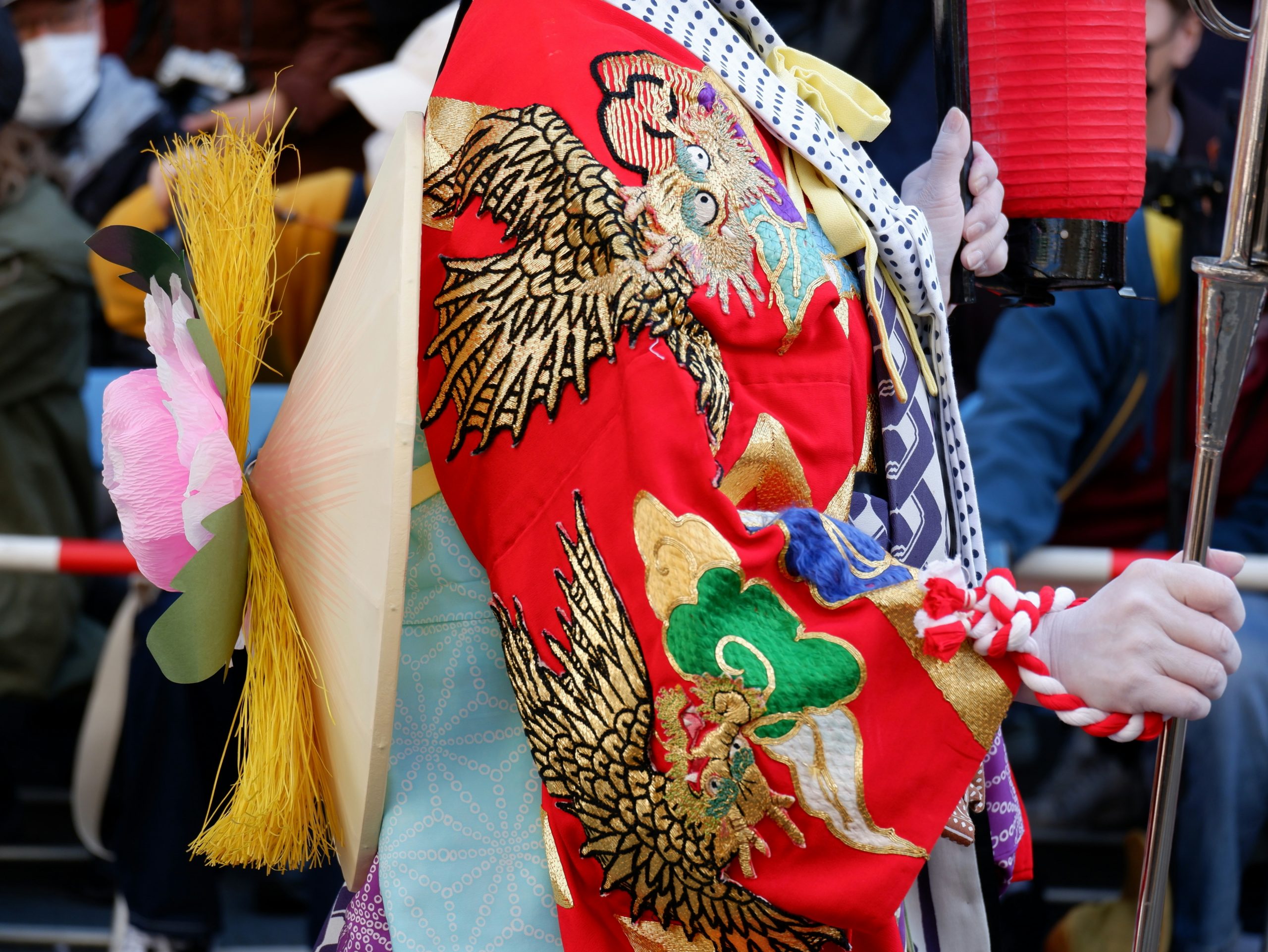 Romantic couple wearing colorful traditional Japanese kimono posing together at Yasaka Shrine in Kyoto, showcasing the elegance and cultural significance of kimono rental experiences for visitors