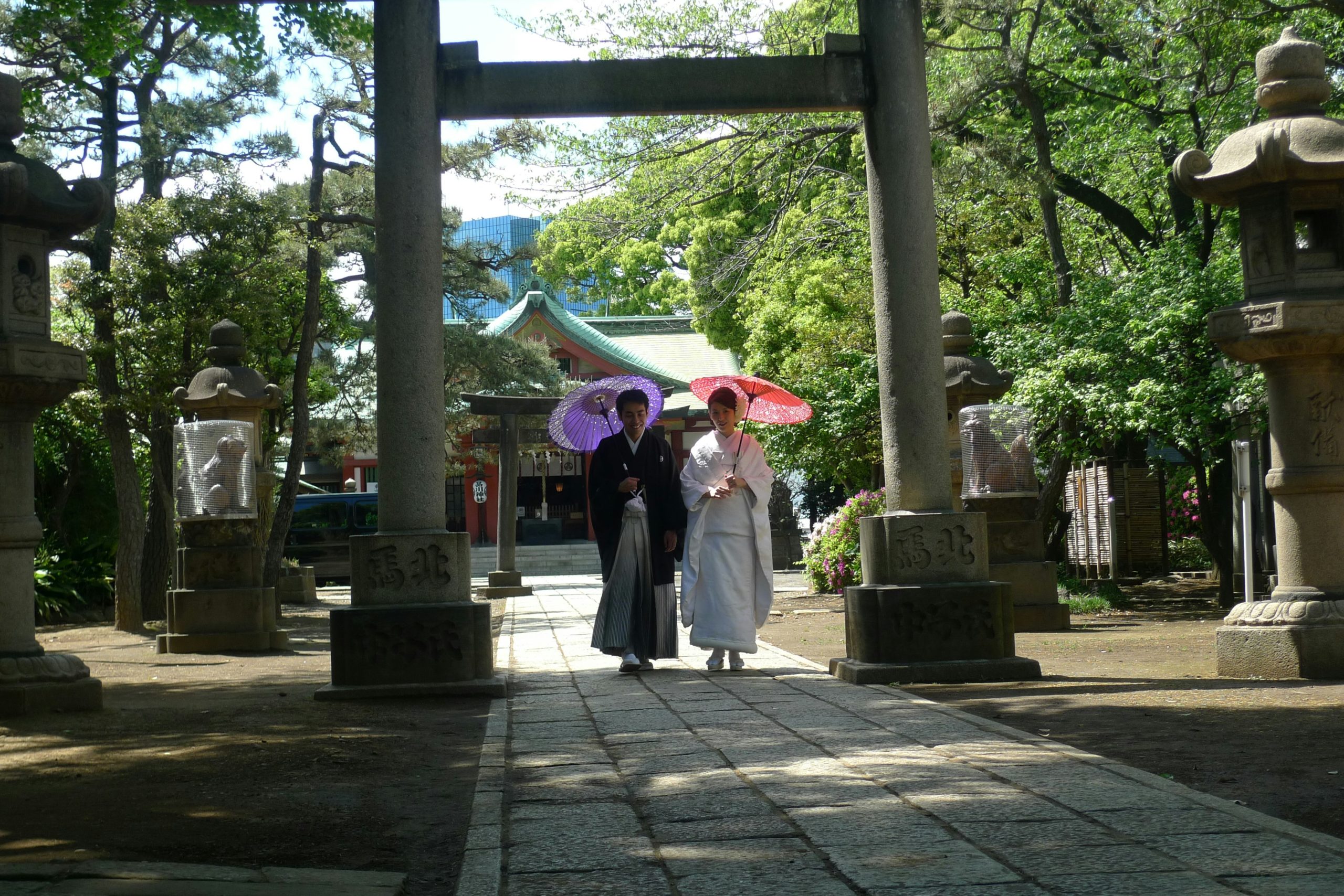 Atmospheric evening view of traditional Kyoto temples with glowing lanterns creating magical ambiance for kimono photography