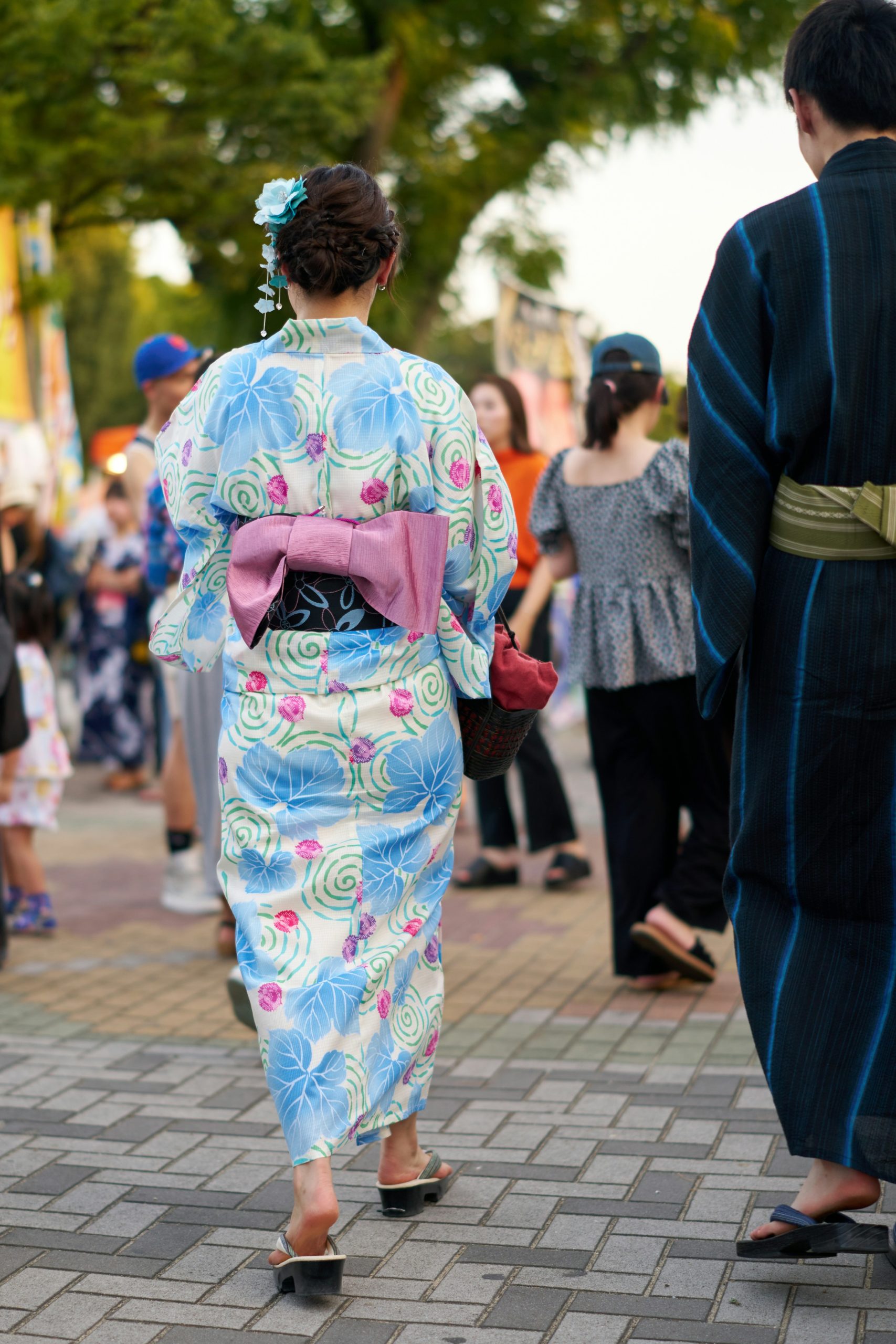 Traditional Japanese kimono rental experience Kyoto with colorful kimonos displayed for tourists and visitors