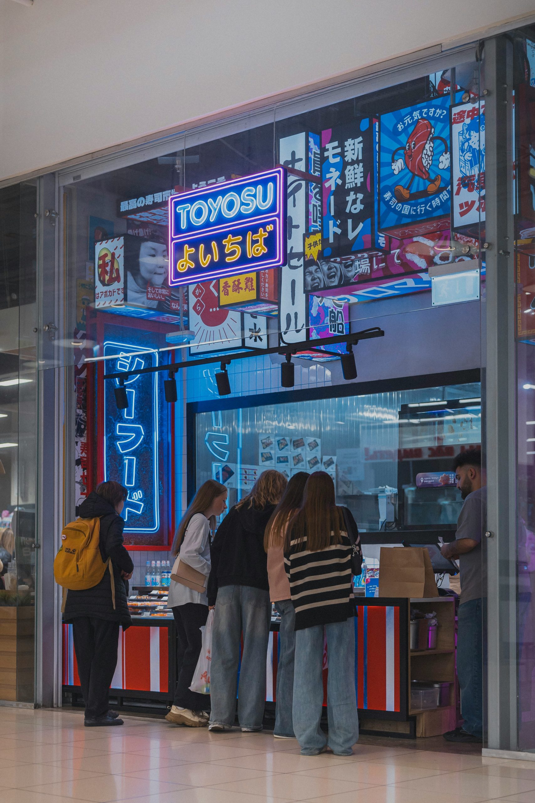 Woman wearing traditional kimono walking through historic Kyoto temple street showcasing Japanese cultural heritage