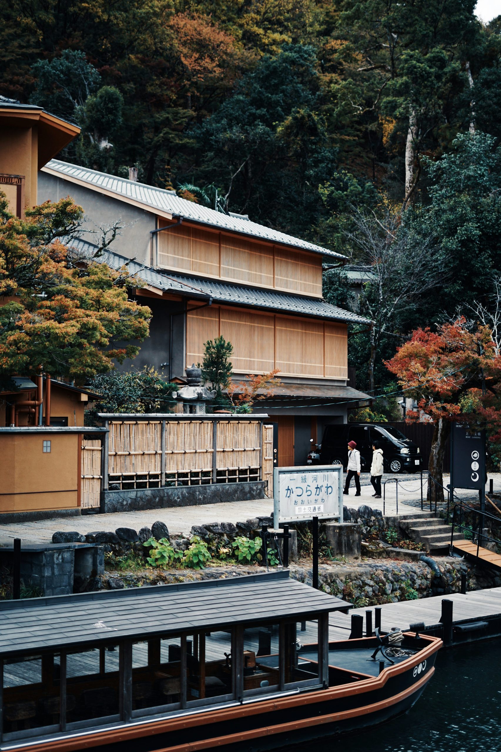 Traditional Kyoto machiya townhouse wooden architecture with latticed fronts displaying centuries-old Japanese building design