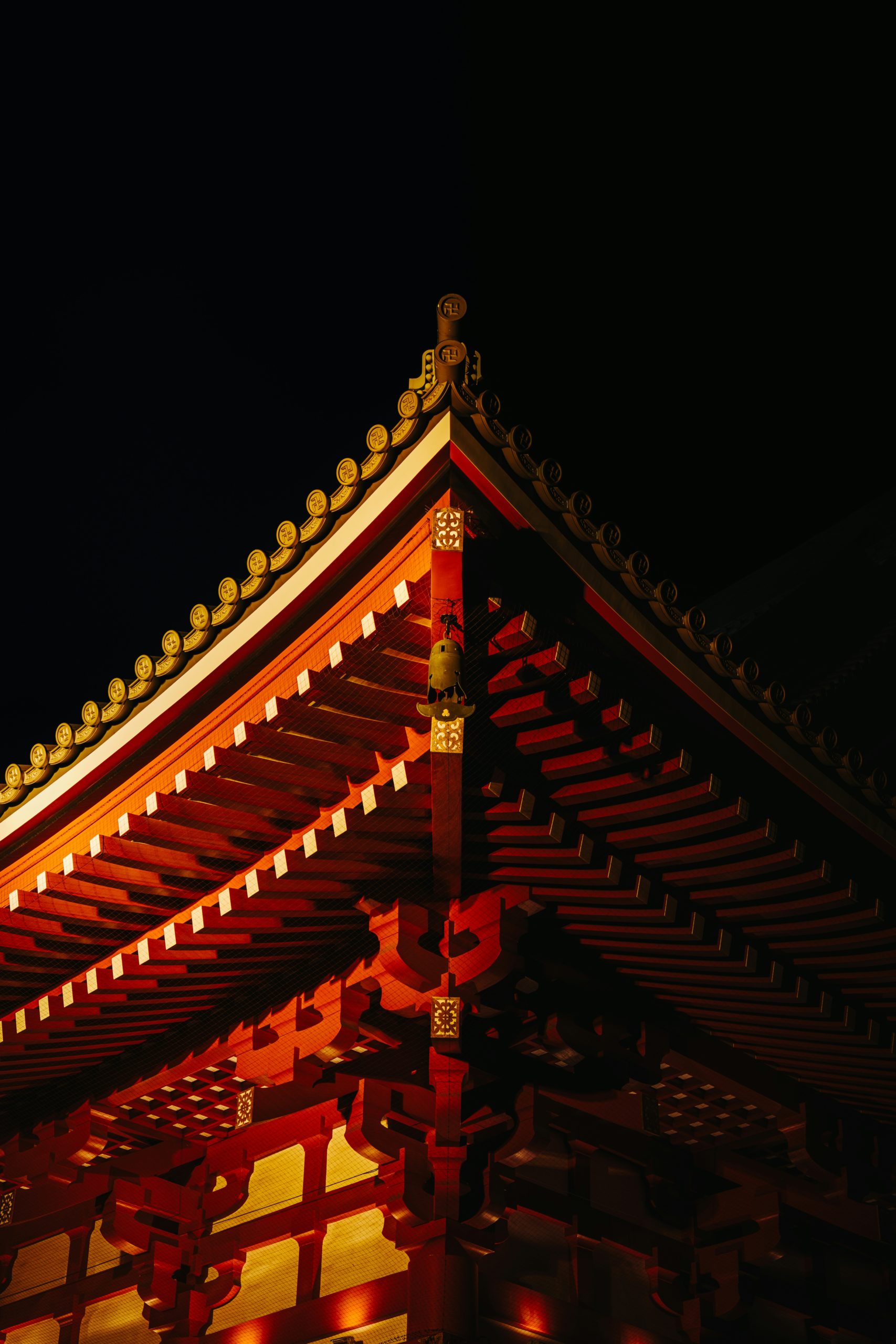 Kiyomizu-dera Temple in Kyoto illuminated at night during cherry blossom season with famous wooden stage terrace pagoda and sakura trees lit up for special nighttime viewing yozakura